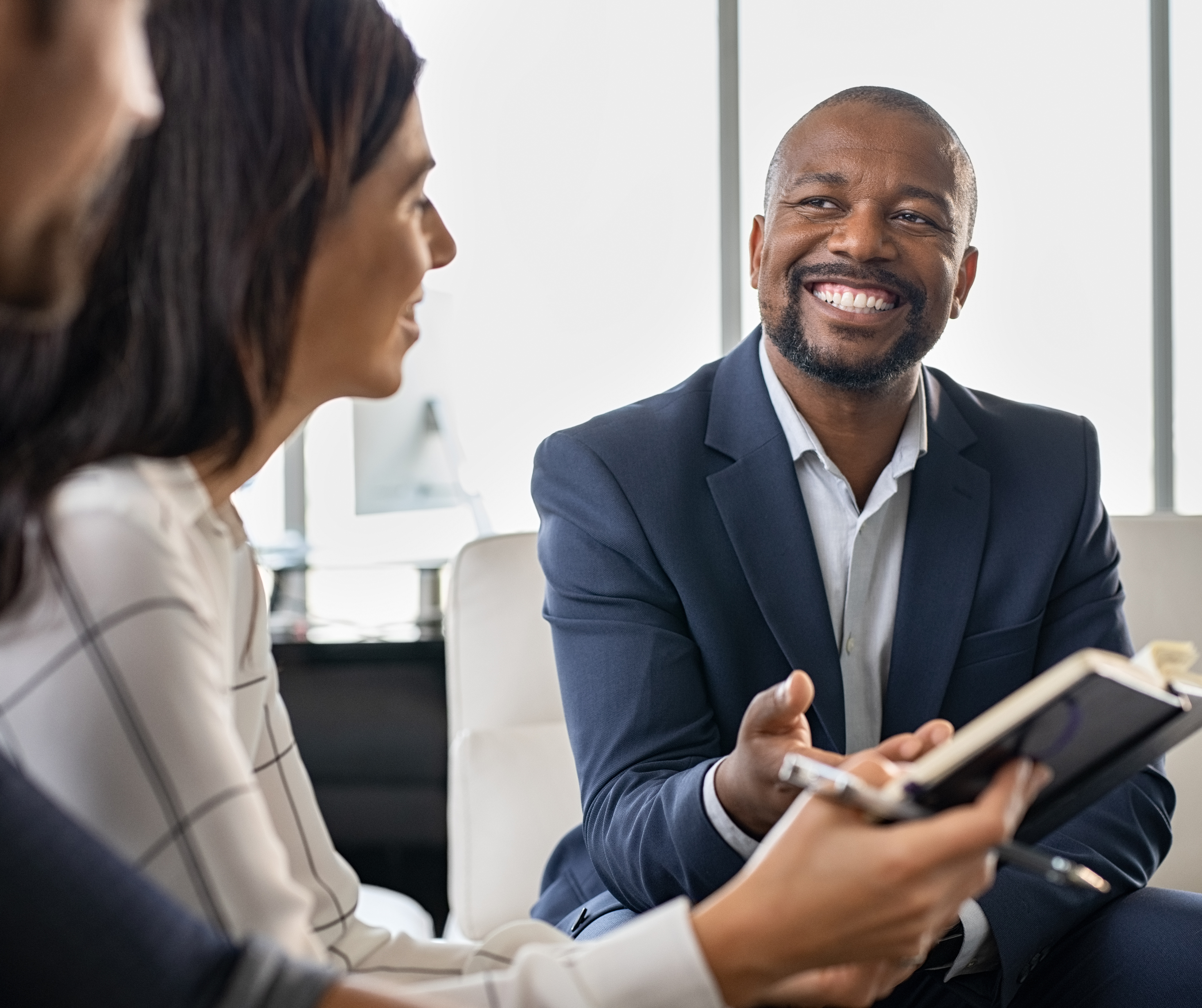 Businessman discussing policies with customers
