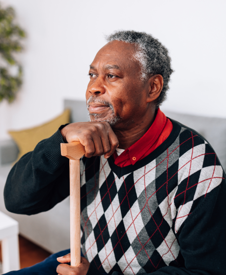 Elderly Batswana man pondering.