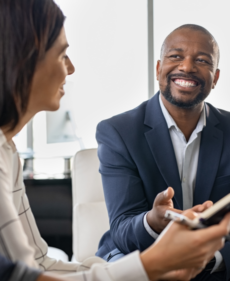 Businessman discussing policies with customers