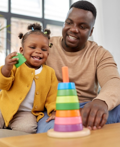 Father playing with toddler