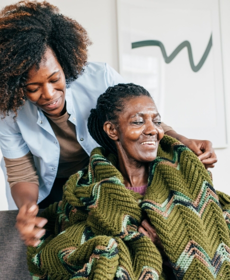 Nurse with elderly lady happy