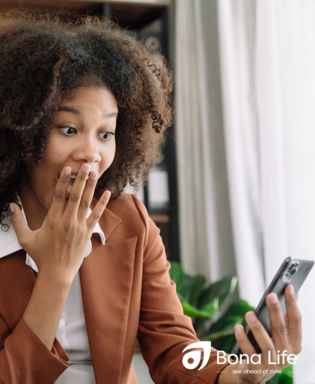Professional women looking at phone with a astonished reaction