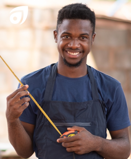 Male carpenter using tape measure